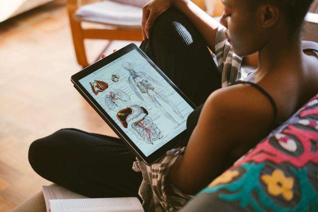 photo of woman studying anatomy